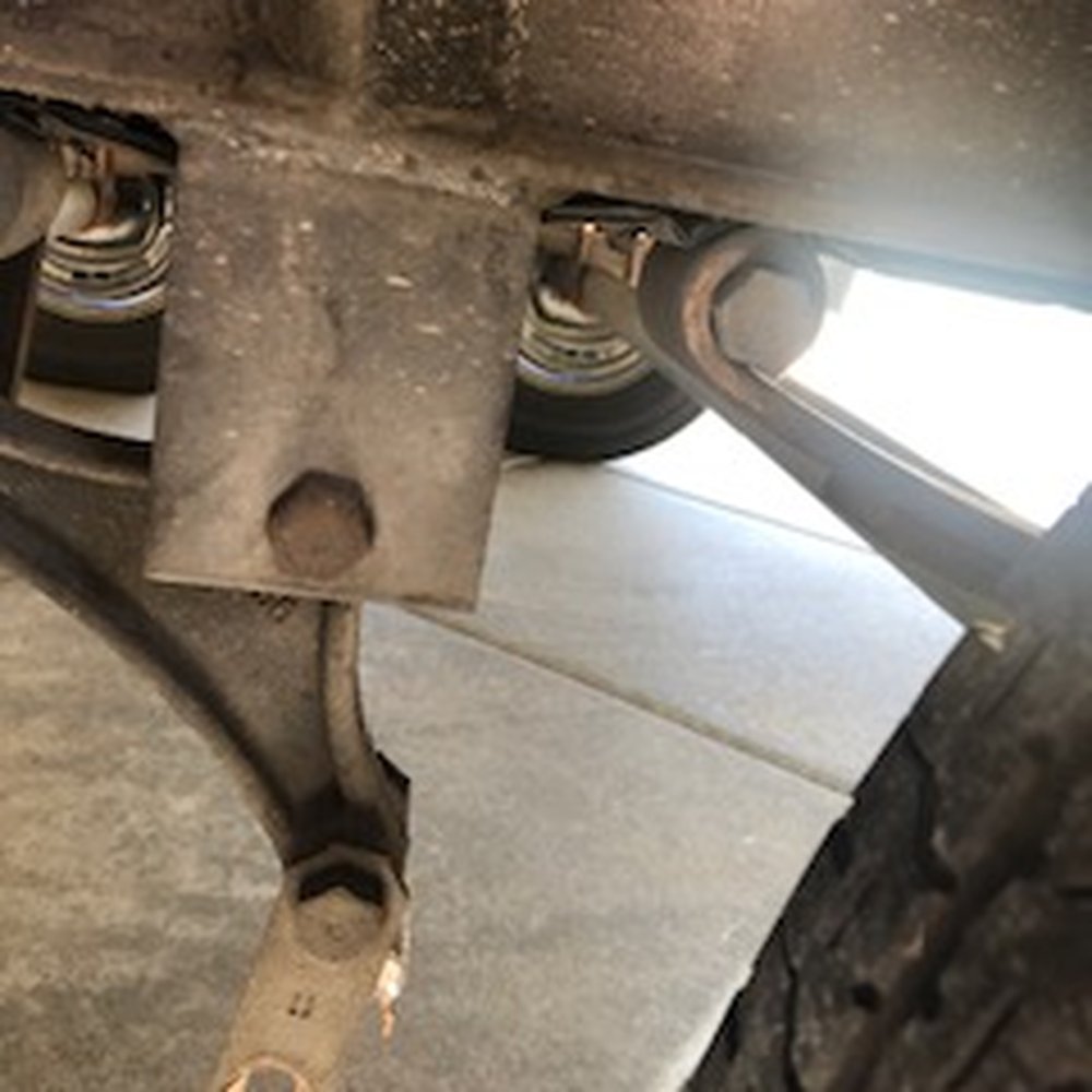Broken shackle. Note the spring is riding on the trailer frame. Check your suspension components Broken shackle. Note the spring is riding on the trailer frame. Check your suspension components