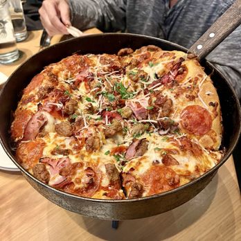 BJ's Restaurant & Brewhouse - Shareable pizza Gourmet Five Meat Pizza - Shareable - New American Near Me - San Bernardino, California