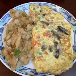 Mediterranean Omelette w/ delicious potatoes and peppers on the side Mediterranean Omelette w/ delicious potatoes and peppers on the side