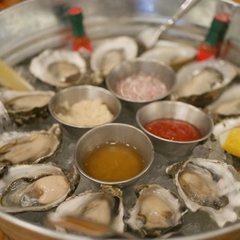 Fishwives - Sampler oysters. The extra sauces were dericious. - Seafood Near Me - Pasadena, California Fishwives - Sampler oysters. The extra sauces were dericious. - Seafood Near Me - Pasadena, California