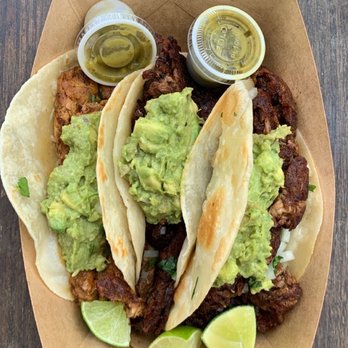 Asador - three tacos with guacamole and lime wedges - Tacos Near Me - Austin, Texas Asador - three tacos with guacamole and lime wedges - Tacos Near Me - Austin, Texas