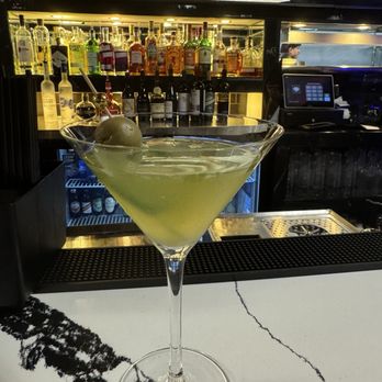 Michael's Restaurant - Re-created spicy Tito's, Jalapeño and stuffed olive martini--excellent! - American Near Me - Upper Marlboro, Maryland