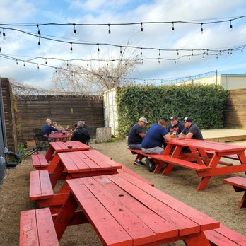 St Elmo Brewing Company - Outside patio area with music stage in corner - Breweries Near Me - Austin, Texas