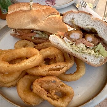 Carla - Shrimp Po' boy with Beer-Battered Onion Rings - Tacos Near Me - Long Island City, New York Carla - Shrimp Po' boy with Beer-Battered Onion Rings - Tacos Near Me - Long Island City, New York