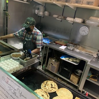 Martin's Bakery - a man preparing food in a kitchen - Bakeries Near Me - Toronto, Ontario
