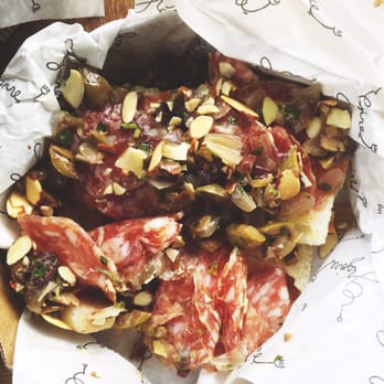 Grégoire - Thinly sliced local salame nostrano with olive salsa and almonds on grilled ciabatta - French Near Me - Berkeley, California Grégoire - Thinly sliced local salame nostrano with olive salsa and almonds on grilled ciabatta - French Near Me - Berkeley, California