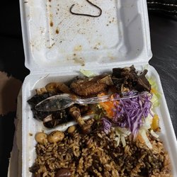 Donna's Caribbean Restaurant - What ever that is was lodged in one of the oxtail in between the meat.