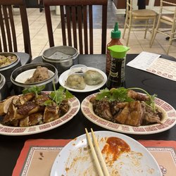 Mai Dim Sum - Soy sauce chicken (left front) Roast duck (right front) Shrimp and chives pan fried dumpling  Steamed beef meatball Har gow  Pork dumplings