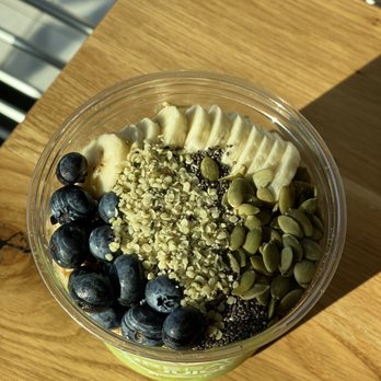 Pure Raw Juice - Omega Blast Green Bowl toppings: Blueberries, pumpkin seeds, chia, with hemp and banana added - Juice Bars & Smoothies Near Me - Baltimore, Maryland