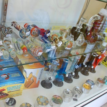 Mini Mart & Tobacco - a display case full of various types of tobacco - Tobacco Shops Near Me - Long Beach, California