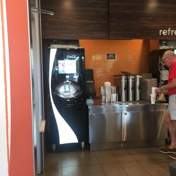 McDonald's - a man standing in front of a coffee machine - Fast Food Near Me - Beaufort, South Carolina