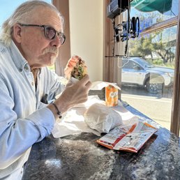 People watch or daydream while you eat your lunch at the bar seating in the windows. Cali Sandwich in hand. People watch or daydream while you eat your lunch at the bar seating in the windows. Cali Sandwich in hand.