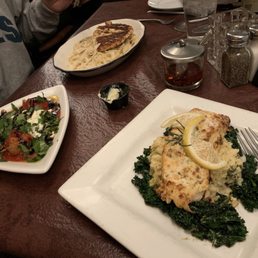 Delicious special salmon with risotto and wilted kale Delicious special salmon with risotto and wilted kale