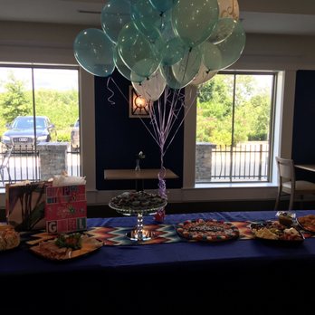 Lula's Brownies - a table with balloons and snacks - Custom Cakes Near Me