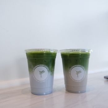 Blue Hummingbird Roastery - BHB Matcha Latte with almond milk on the left,
BHB Matcha Latte with oat milk on the right - Coffee Roasteries Near Me - Irvine, California Blue Hummingbird Roastery - BHB Matcha Latte with almond milk on the left,
BHB Matcha Latte with oat milk on the right - Coffee Roasteries Near Me - Irvine, California