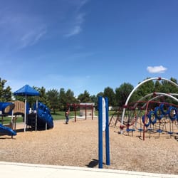 Ages 2-5 on the left and 5-12 on the right. It's a great little park with a large field of grass!