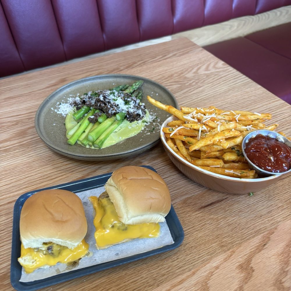Canard - Steamer burger, garlic, fries, asparagus, and morales in hollandaise sauce - New American Near Me - Beaverton, Oregon
