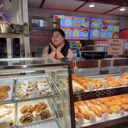 Piroshky Bakery - The excellent service person in front of the baked goods.