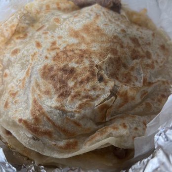 Taqueria Elena - a tortilla wrapped in foil - Food Trucks Near Me - Houston, Texas Taqueria Elena - a tortilla wrapped in foil - Food Trucks Near Me - Houston, Texas