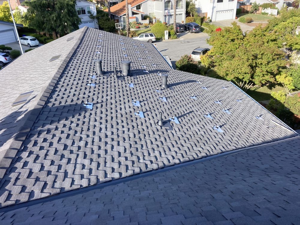 Slide of Mel's Roofing