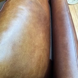 Sun fading on pillow back, but not on sofa.  Protectant was applied to this portion of the sofa back but not the leather on the pillow.