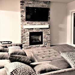 Smart Home Services - I love this room. TV mounted above fireplace.