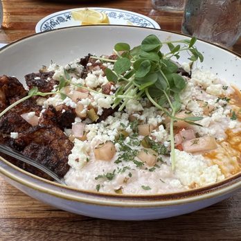 The Floridian - Ship n' grits with passion fruit and goat cheese. - Southern Near Me - Saint Augustine, Florida The Floridian - Ship n' grits with passion fruit and goat cheese. - Southern Near Me - Saint Augustine, Florida