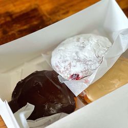The Bake Shoppe On Main - Boston crème, maple creamer and raspberry jelly donut