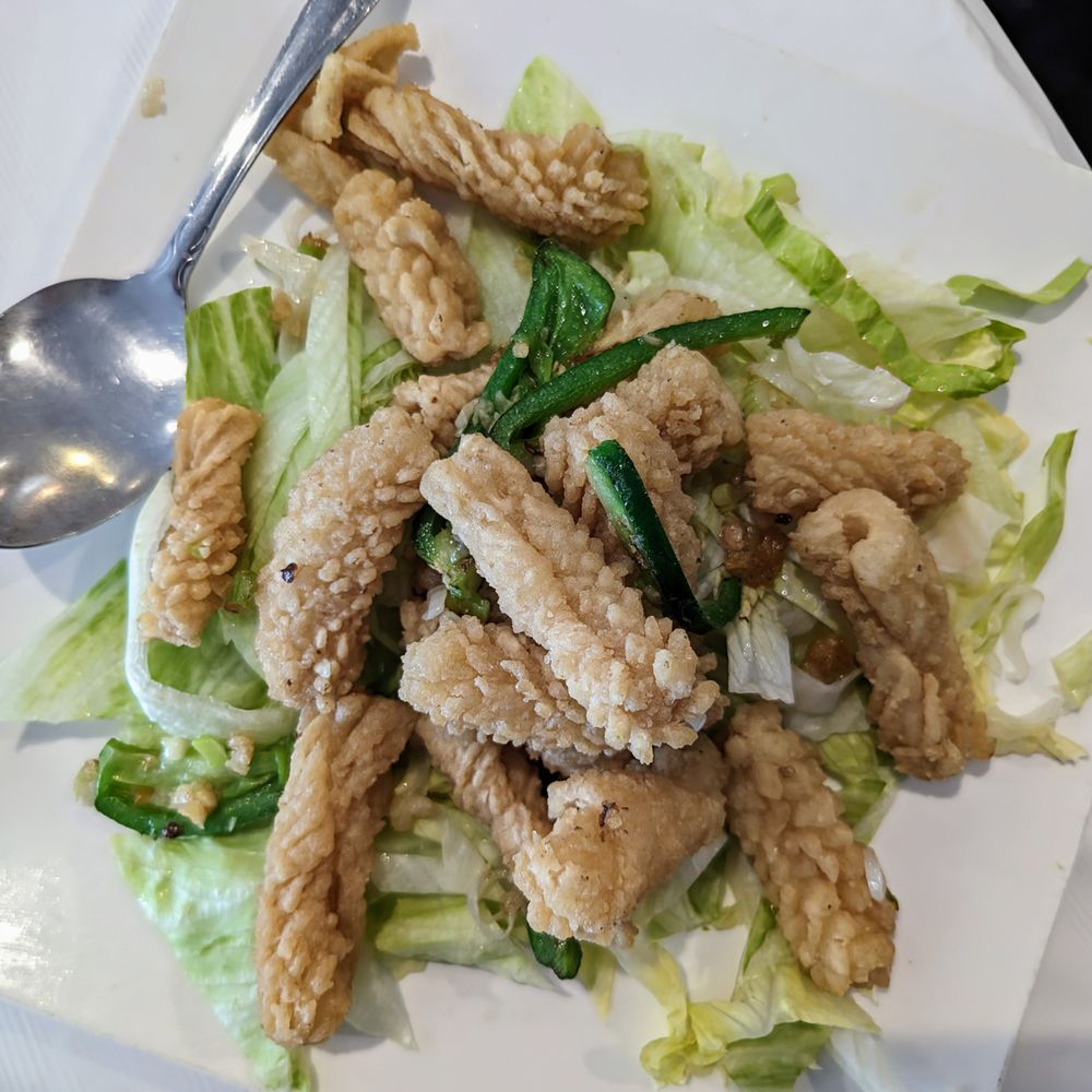 Salt-and-pepper squid on a bed of shredded lettuce. Salt-and-pepper squid on a bed of shredded lettuce.