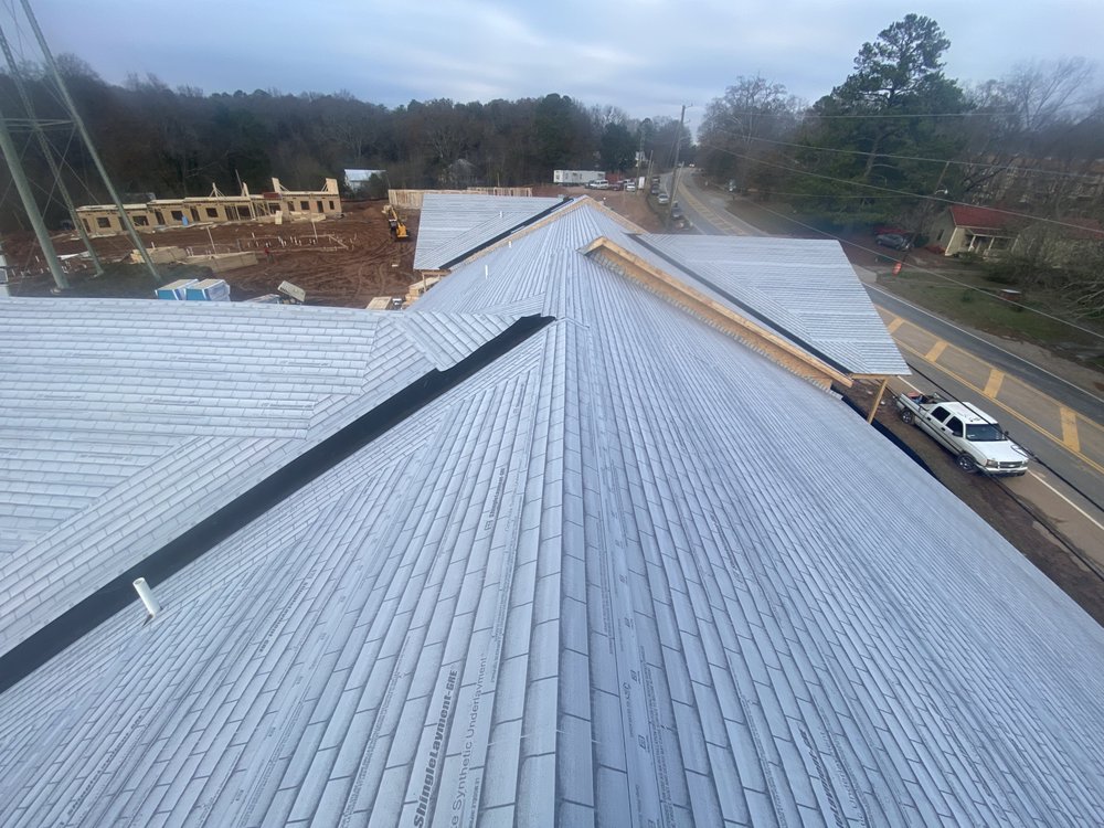 Slide of Rico’s Roofing Restorations