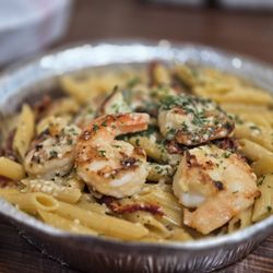 Brunch N Burger - Penne Pasta tossed in a Cajun Seasoned, Sun Dried Tomato Cream Sauce, topped with Fresh Parsely.