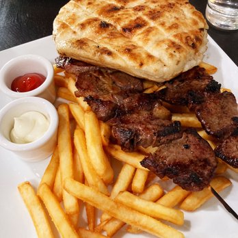 7 Restaurant - Raznjici - delicious grilled steak on a skewer with fries (menu doesn't say it comes w/pita, but when they brought my plate it had one) - Modern European Near Me - Vancouver, Washington