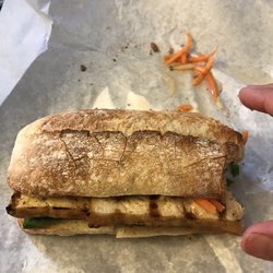 Pho Yum - Banh Mi Sandwich - minus the first bite. Tip of thumb for scale.