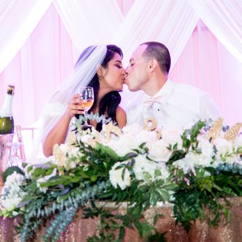 De Young Flowers - We re-used our ceremony arch arrangement on our sweetheart table at the reception - Party & Event Planning Near Me - Campbell, California De Young Flowers - We re-used our ceremony arch arrangement on our sweetheart table at the reception - Party & Event Planning Near Me - Campbell, California