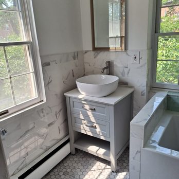 MPC General Contracting Corp - a bathroom with a sink and tub - General Contractors Near Me MPC General Contracting Corp - a bathroom with a sink and tub - General Contractors Near Me