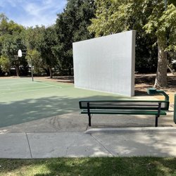 Walnut Grove Park - Shaded park bench by pseudo-handball wall