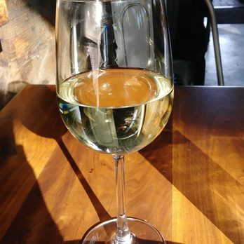The Vig Fillmore - A glass of their house wine (poured from a craft at the table) - New American Near Me - Phoenix, Arizona The Vig Fillmore - A glass of their house wine (poured from a craft at the table) - New American Near Me - Phoenix, Arizona