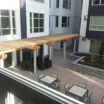 525 At The Enclave by Pinnacle - Courtyard fireplace. - Apartments Near Me - Seattle, Washington 525 At The Enclave by Pinnacle - Courtyard fireplace. - Apartments Near Me - Seattle, Washington