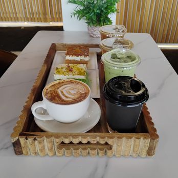 Raha Coffee House - All the goods! Raha signature latte, pistachio milk cake, caramel milk cake, pistachio latte, caramel latte, matcha latte and hot chocolate - Coffee & Tea Near Me - Buffalo, New York Raha Coffee House - All the goods! Raha signature latte, pistachio milk cake, caramel milk cake, pistachio latte, caramel latte, matcha latte and hot chocolate - Coffee & Tea Near Me - Buffalo, New York