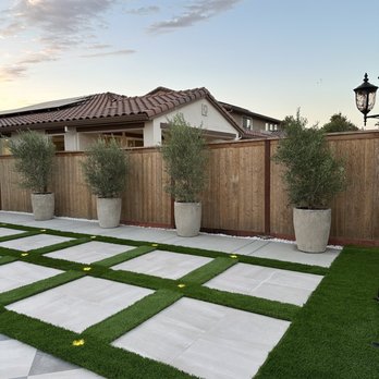 Onpoint Landscaping - a modern backyard with artificial grass - Landscaping Near Me Onpoint Landscaping - a modern backyard with artificial grass - Landscaping Near Me
