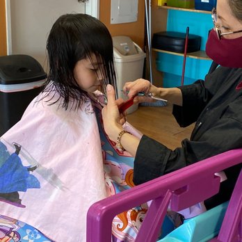 Fran's Fun Cuts 4 Kids - They cut her hair while she sits in a toy vehicle watching a Disney animation - Kids Hair Salons Near Me - Upland, California
