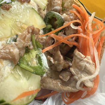 Pho 772 - was supposed to be grilled pork...but pretty sure it's chicken cooked in a sauce. Not for me. - A Vietnamese dish featuring sliced pork, cucumber, green peppers, and shredded carrots, served with a creamy sauce. - Vietnamese Near Me - Jensen Beach, Florida