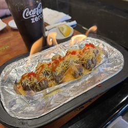 Sushico Hibachi and Asian Cuisine - Texas Ranger Roll (yes! It's on fire!) so freaking good. The steak was wonderful on it!