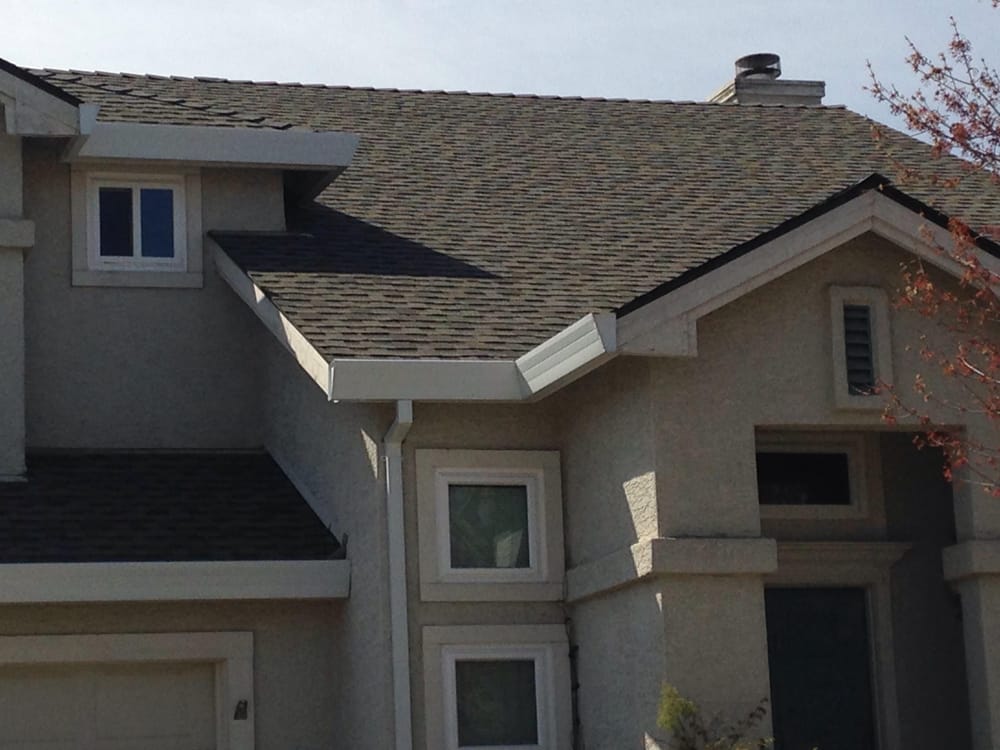 Slide of Whittaker Roofing