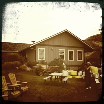Rio Vista Wines - a woman standing in front of a house - Wineries Near Me - Chelan, Washington Rio Vista Wines - a woman standing in front of a house - Wineries Near Me - Chelan, Washington