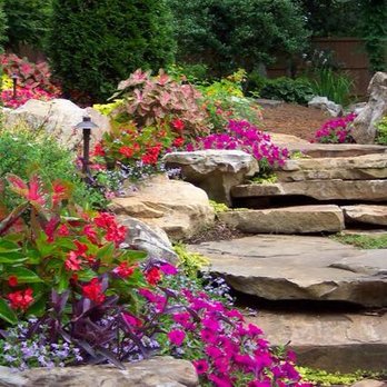GM Landscape - a garden with flowers and rocks - Tree Services Near Me