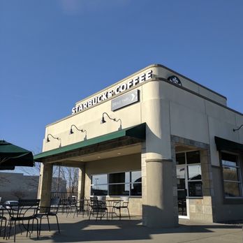 Starbucks - the outside of a coffee shop with tables and umbrellas - Coffee & Tea Near Me - Shelbyville, Indiana Starbucks - the outside of a coffee shop with tables and umbrellas - Coffee & Tea Near Me - Shelbyville, Indiana
