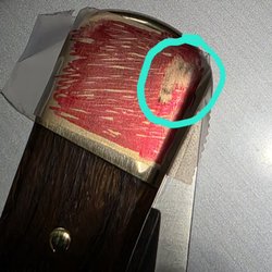 Marking dye used to show damage from snap hardware.