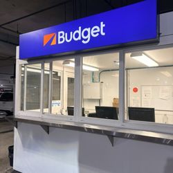 Budget Car Rental - The Booth inside the garage where we waited forever to get our car