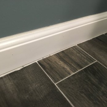 DHI Builders - Debris in the caulk - General Contractors Near Me
